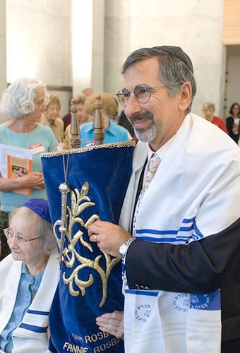 David Friedman holding the Torah at the new synagogue's dedication